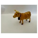 Porcelain Bulldogs and Cows, Toy Car, Norwegian Flag, and Countryside Print.