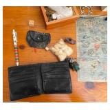 Books on Travel to Europe and Variety of Trinkets, Leather Wallets, and Necklaces for Men.
