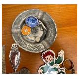 Books on Travel to Europe and Variety of Trinkets, Leather Wallets, and Necklaces for Men.