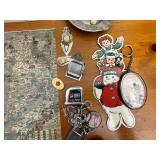 Books on Travel to Europe and Variety of Trinkets, Leather Wallets, and Necklaces for Men.