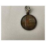 Books on Travel to Europe and Variety of Trinkets, Leather Wallets, and Necklaces for Men.