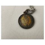 Books on Travel to Europe and Variety of Trinkets, Leather Wallets, and Necklaces for Men.