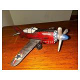 Vintage cast iron P 40 Warhawk fighter plane measuring 10 inches long by 10 inches wide