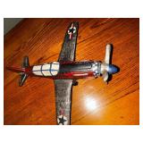 Vintage cast iron P 40 Warhawk fighter plane measuring 10 inches long by 10 inches wide