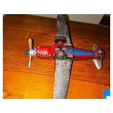 Vintage cast iron P 40 Warhawk fighter plane measuring 10 inches long by 10 inches wide