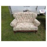 Vintage Floral Upholstered Loveseat with Carved Wood Accents