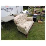 Vintage Floral Upholstered Loveseat with Carved Wood Accents
