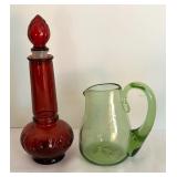 Variety of Colorful Glass Bottles and Vases
