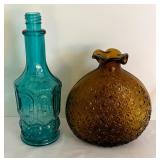 Variety of Colorful Glass Bottles and Vases
