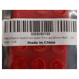 Three HOWLUM Double-Faced Silicone Suction Phone Case Adhesive Mounts in Red