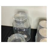 Collection of Assorted Glass Jars and Metal Containers