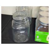 Collection of Assorted Glass Jars and Metal Containers