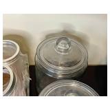 Collection of Assorted Glass Jars and Metal Containers