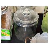 Collection of Assorted Glass Jars and Metal Containers