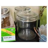 Collection of Assorted Glass Jars and Metal Containers
