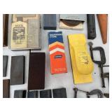 Assorted Sharpening Stones, Honing Oil, and Clamps