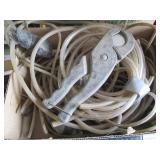 Assorted Plastic and Rubber Hoses with Hose Cutter