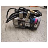 Portable PowerPal air compressor, jumper cables, 2 quarts of motor oil (Mag 1 is open and about 75% full) and one John Deer T19044 oil filter for tractors