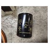 Portable PowerPal air compressor, jumper cables, 2 quarts of motor oil (Mag 1 is open and about 75% full) and one John Deer T19044 oil filter for tractors