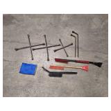 3 4-way lug wrenches (2 - 20" and 1 - 14" wrench), 2 lug nut wrenches (1 - 18" and 1 - 21") and 4 ice scrapers / snow brushes
