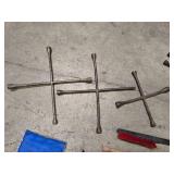 3 4-way lug wrenches (2 - 20" and 1 - 14" wrench), 2 lug nut wrenches (1 - 18" and 1 - 21") and 4 ice scrapers / snow brushes