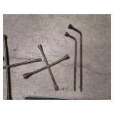 3 4-way lug wrenches (2 - 20" and 1 - 14" wrench), 2 lug nut wrenches (1 - 18" and 1 - 21") and 4 ice scrapers / snow brushes