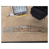 Vintage metal Kenworth sign, portable light, and mini tool case with a variety of tools