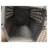 small portable kennel and dog bowl