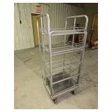 5 1/2 ft tall stainless steel rolling rack (several of the wheels are locked up so it doesn