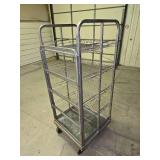 5 1/2 ft tall stainless steel rolling rack (several of the wheels are locked up so it doesn