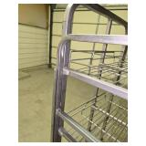 5 1/2 ft tall stainless steel rolling rack (several of the wheels are locked up so it doesn