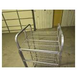 5 1/2 ft tall stainless steel rolling rack (several of the wheels are locked up so it doesn