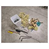 a bucket of bungee straps / tie downs/ and ropes, 2 windshield brushes and 2 tire irons