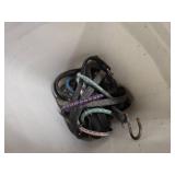 a bucket of bungee straps / tie downs/ and ropes, 2 windshield brushes and 2 tire irons
