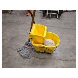 Rubbermaid Commercial mop bucket and wringer combo on wheels (missing 1 wheel), 1 mop and 1 replacement mop head