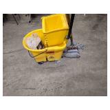 Rubbermaid Commercial mop bucket and wringer combo on wheels (missing 1 wheel), 1 mop and 1 replacement mop head