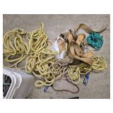 a bucket of bungee straps / tie downs/ and ropes, 2 windshield brushes and 2 tire irons