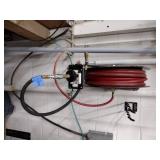 Self-retracting Storing Air Hose Reel with hose.