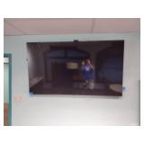 Samsung 75” TV with Samsung remote and Roku Remote.