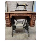 Antique Singer Sewing Machine Table with foot operated Crank and Detailed Carvings
