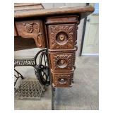 Antique Singer Sewing Machine Table with foot operated Crank and Detailed Carvings