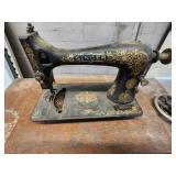 Antique Singer Sewing Machine Table with foot operated Crank and Detailed Carvings