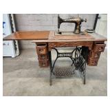 Antique Singer Sewing Machine Table with foot operated Crank and Detailed Carvings