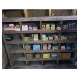 VINTAGE GARAGE SHELF FILLED WITH VINTAGE BOXES OF GOODIES