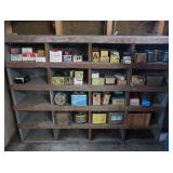 VINTAGE GARAGE SHELF FILLED WITH VINTAGE BOXES OF GOODIES