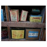 VINTAGE GARAGE SHELF FILLED WITH VINTAGE BOXES OF GOODIES