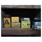 VINTAGE GARAGE SHELF FILLED WITH VINTAGE BOXES OF GOODIES