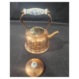 Vintage Copper Tea Kettle with Decorative Handle and Porcelain Coffee Set