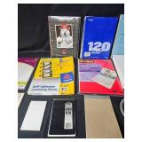 Office Supplies Lot Including Notebooks, Laminating Sheets, and Sheet Protectors