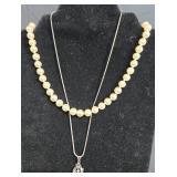 Vintage Jewelry Lot Including Pearl Necklace, Cross Pendant, and Silver Bracelet